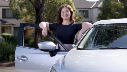 woman getting into car